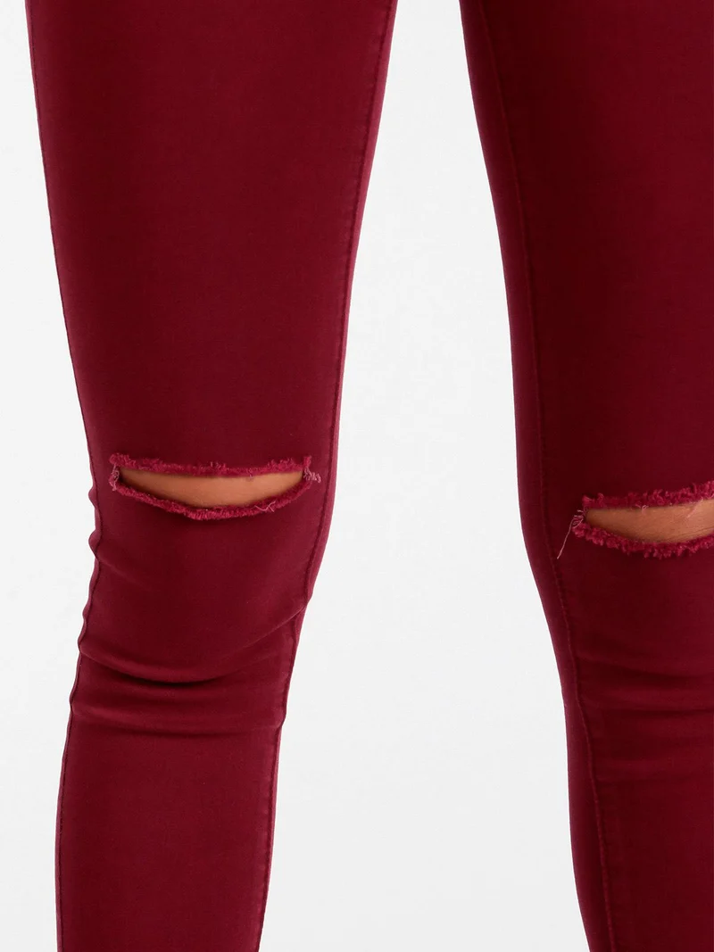 Pantaloni donna skinny con strappi - bordeaux