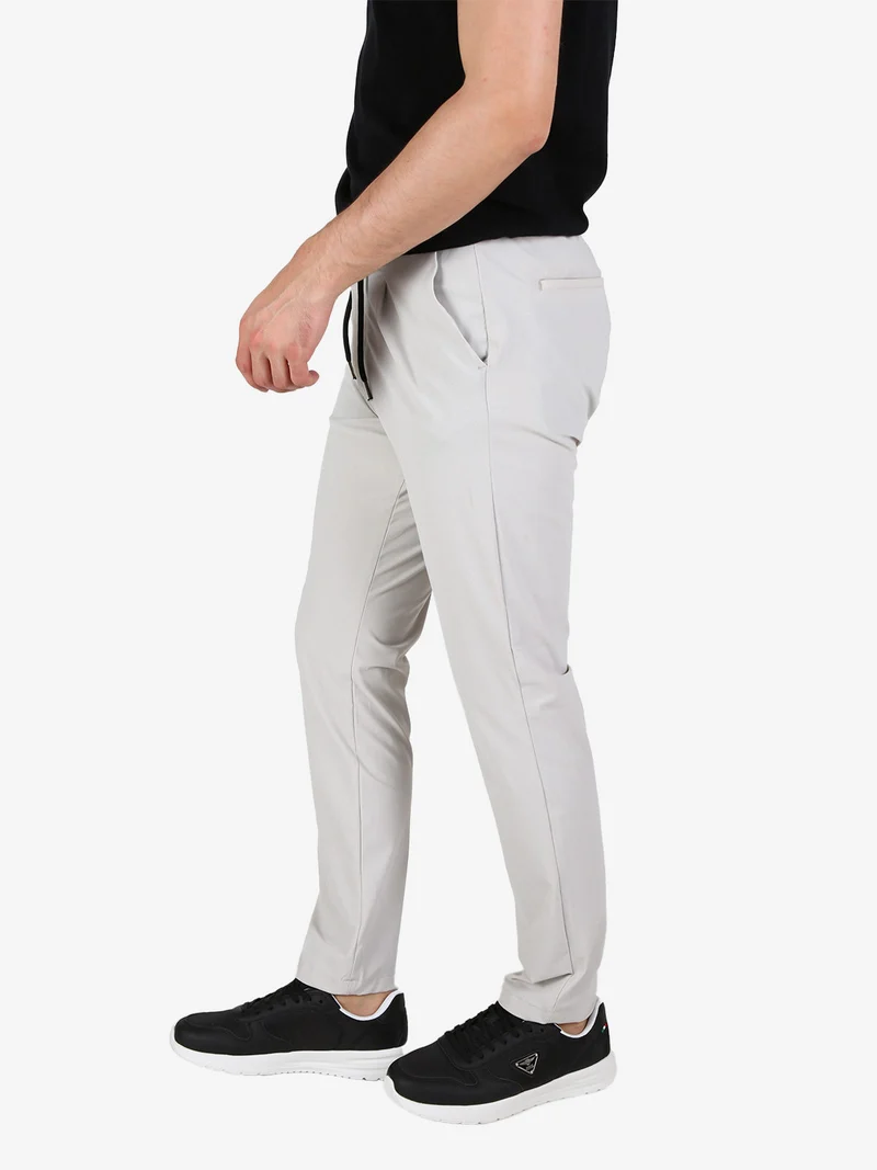 Pantaloni casual da uomo in tessuto tecnico con coulisse - perla