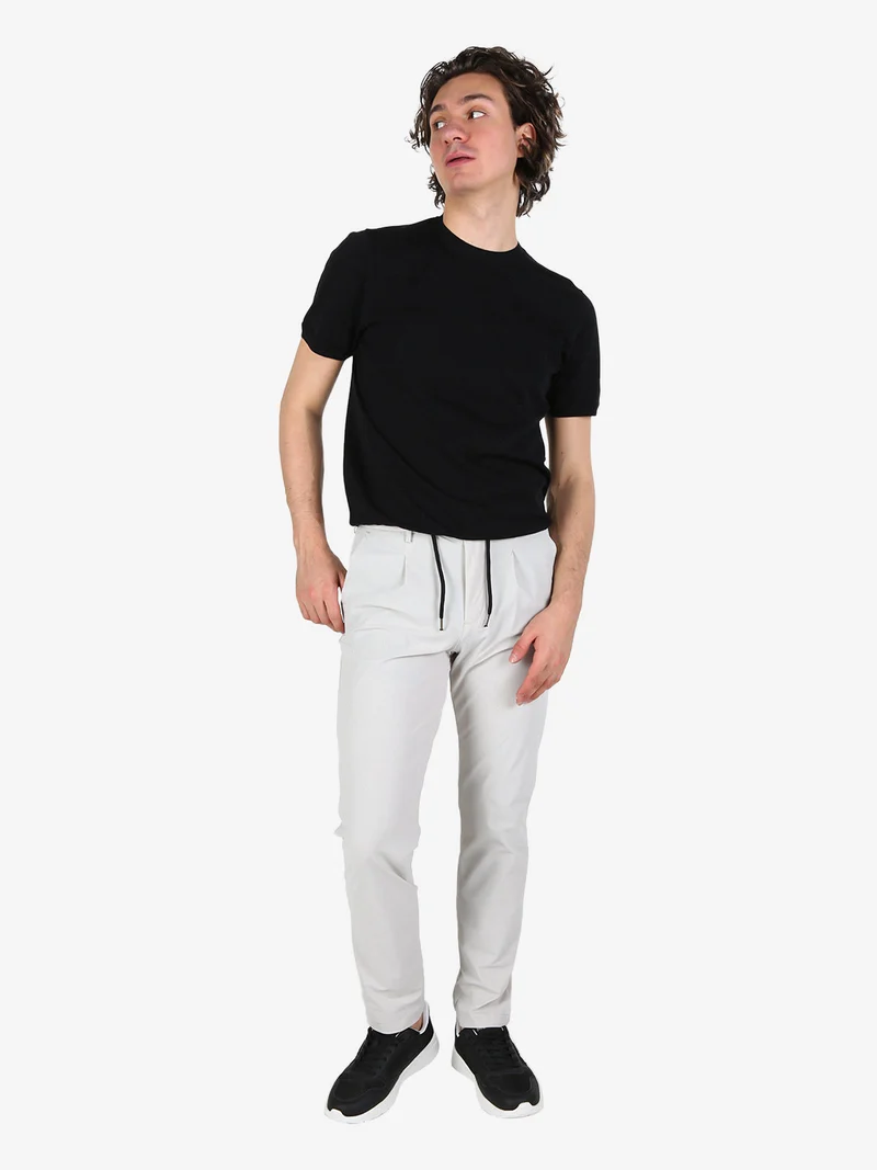 Pantaloni casual da uomo in tessuto tecnico con coulisse - perla