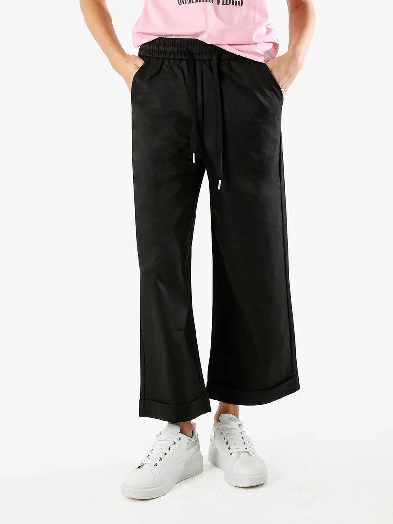 Pantaloni donna a palazzo con risvolto - nero