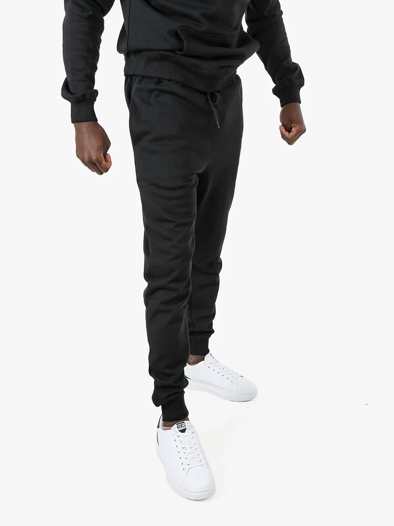 Pantaloni tuta da uomo con coulisse e polsini - nero
