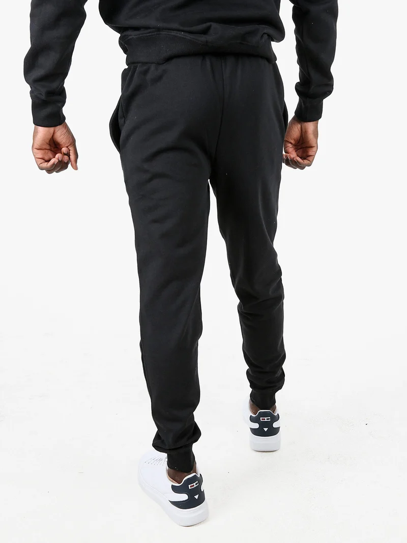 Pantaloni tuta da uomo con coulisse e polsini - nero