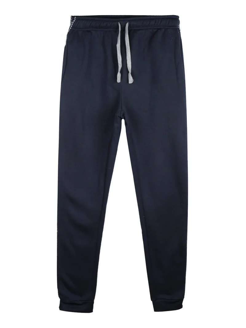 Pantaloni tuta da ragazzo felpati con striscia laterale - blu scuro