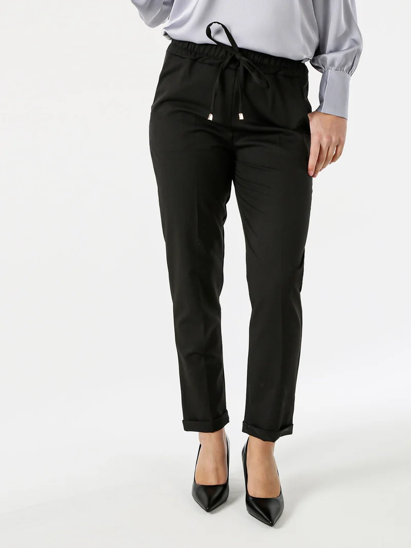 Pantaloni donna casual con elastico in vita e risvolto sul finale - nero